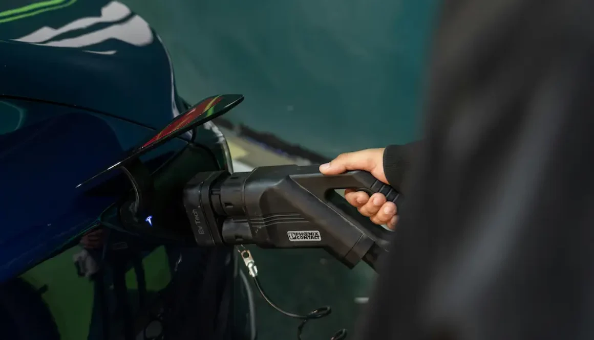 A man charging his ev car in Kerala