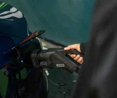 A man charging his ev car in Kerala